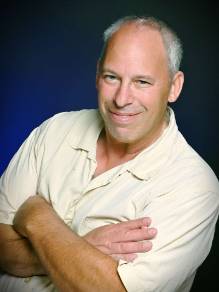 journalism student, eager expression, taking notes, photorealistic, bustling university campus with modern architecture, highly detailed, sounds of footsteps and distant lectures, vibrant and varied colors, dappled sunlight through trees, shot with a 35mm lens.